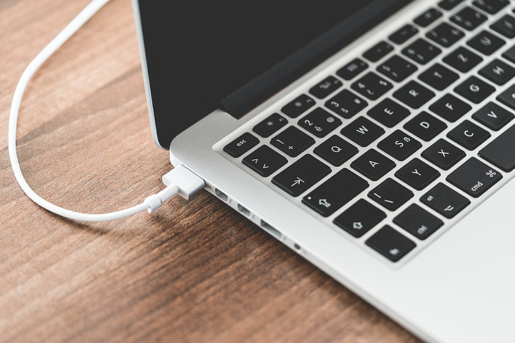 MagSafe charging a MacBook A MacBook with a MagSafe cable plugged into the left side