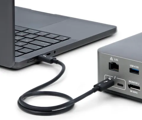 Thunderbolt cable connected to a laptop and dock.